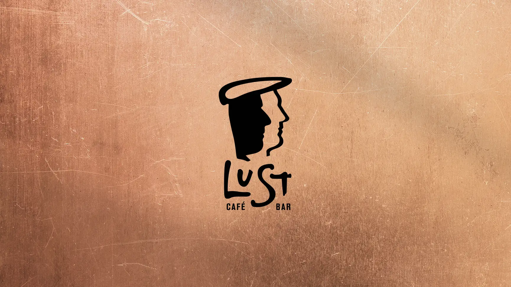 Logo der LuSt Café/Bar geprägt auf einer eleganten Kupfertextur